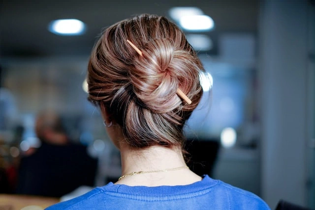 Hair with highlights in bun with pin