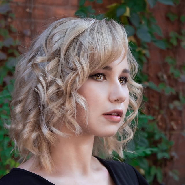 Female customer with blonde curly hair