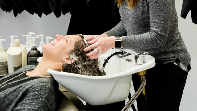 Woman having her hair washed