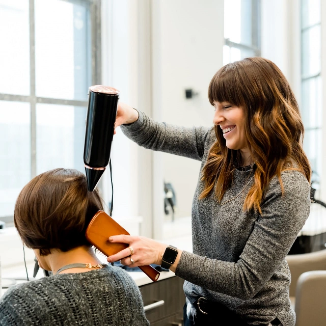 Woman having her hair styled