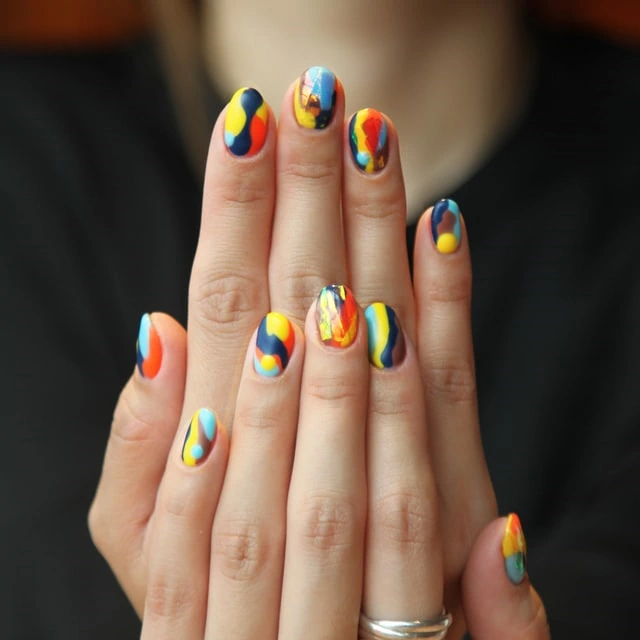 Multicolored polished fingernails