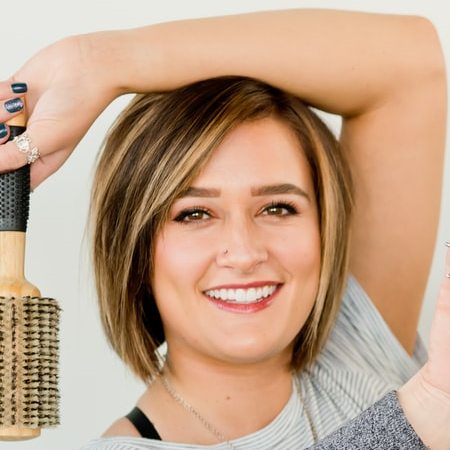 Stylist holding a brush