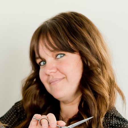 Stylist holding scissors